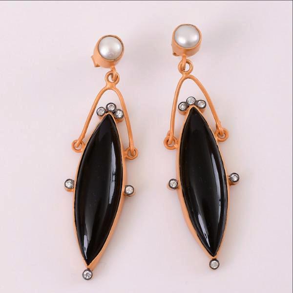 Sterling silver base with 18kt. gold plating is candidly justified. Cubic zirconia around this unique design beautifies the earring to its best potential.