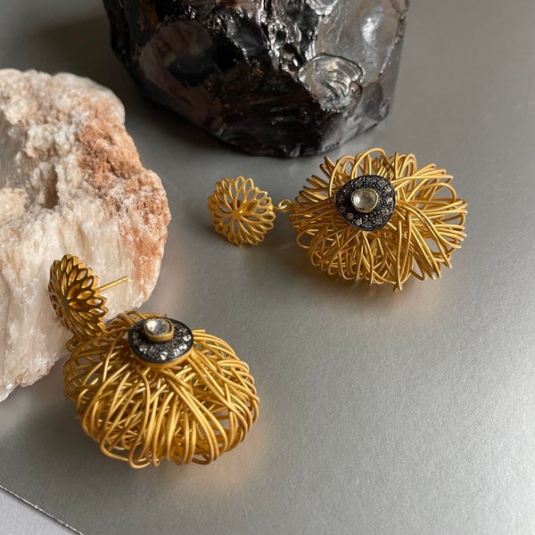 Exquisite & Extravagant! One of my personal favorites from this new collection. An intertwined sterling silver necklace with gold plating is a bold statement piece of jewelry. Its intricate design is mesmerizingly beautiful and eye-catching.