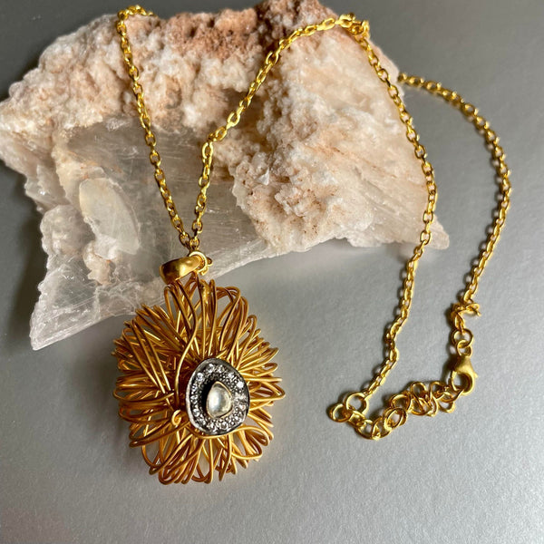 Exquisite & Extravagant! One of my personal favorites from this new collection. An intertwined sterling silver necklace with gold plating is a bold statement piece of jewelry. Its intricate design is mesmerizingly beautiful and eye-catching.
