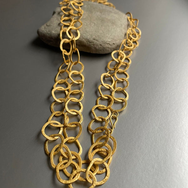 The newly revised and designed necklace is now 50 inches long, and can now be worn in 3 different lengths:  as a single-layered extra-long necklace, double wrapped as well as a triple wrapped so as to make an impressive choker.