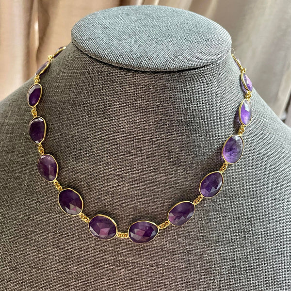 25.56 gms of total weight, this unique 9-inch amethyst necklace in brass with gold plating is mesmerizingly beautiful. Unshaped 19 amethyst strung together with poise and finesse.  With 97.600 gms total weight of amethyst, it is a sheer luxury that one must possess.