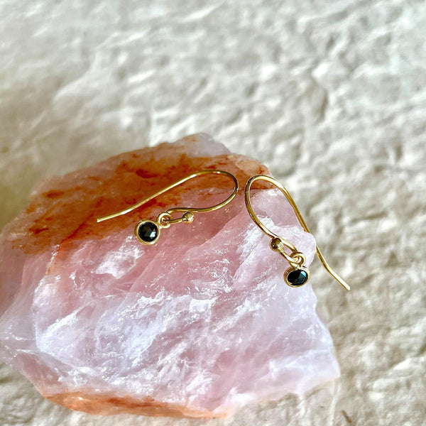 These tiny yet durable,18kt solid gold hook dangle earrings that weigh 0.72 gms of gold and 0.20 ct of natural bezel-set, round black diamonds on each earring, are probably the cutest piece of jewelry you may have seen or would like to own.  A royal addition to your jewelry collection, surely.