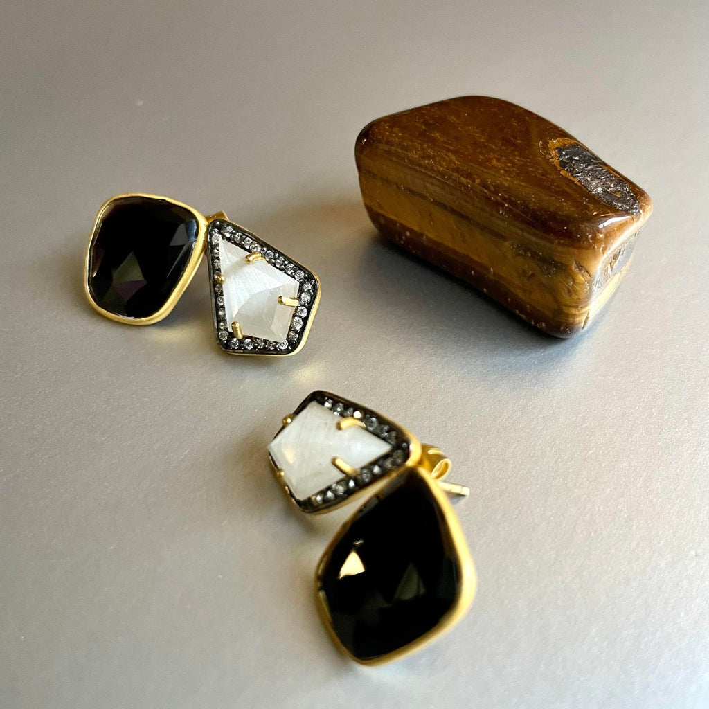 A beautiful amalgamation of black onyx and moonstone is strikingly beautiful with the addition of cubic zirconia to add that perfect bling. The unshaped black onyx is 13x15 and carries a weight of 13.77mm and the moonstone on the other day, also unshaped is 10 x 15 and weighs 6.29mm.  A sophisticated pair of earring studs that can lean from work to evening wear in the blink of an eye.