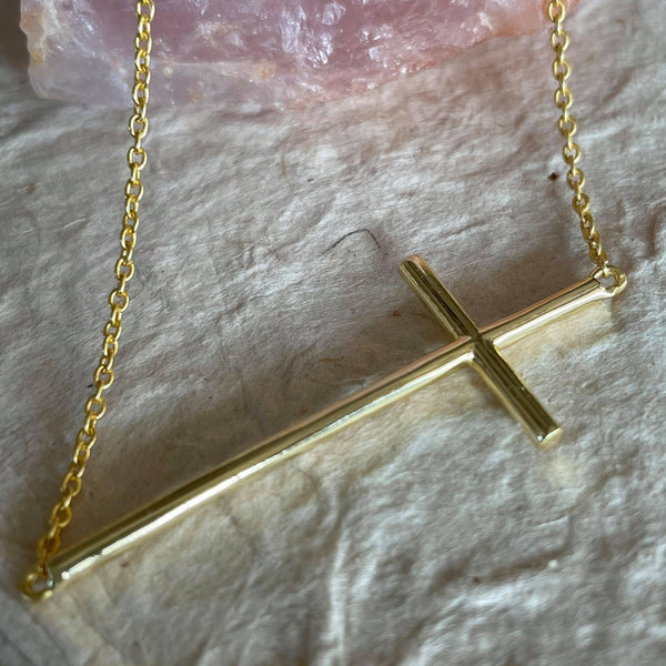 12 inches, when worn and 24- inches in total length, this heartwarming inspiration charm necklace, dangling a sterling silver gold plated - cross, a peace charm, and a heart charm is perfect for everyday personal inspiration or a gift for a loved one. Sterling silver with 18kt gold plating this unique gift will always be cherished for it signifies a universal, zen meaning. The cross is 2 inches in length. Lightweight, versatile, and comfortable to be adorned every day.