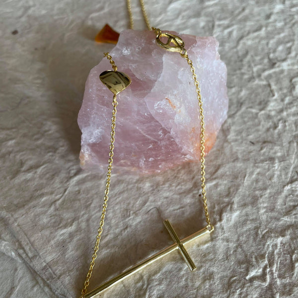 12 inches, when worn and 24- inches in total length, this heartwarming inspiration charm necklace, dangling a sterling silver gold plated - cross, a peace charm, and a heart charm is perfect for everyday personal inspiration or a gift for a loved one. Sterling silver with 18kt gold plating this unique gift will always be cherished for it signifies a universal, zen meaning. The cross is 2 inches in length. Lightweight, versatile, and comfortable to be adorned every day.