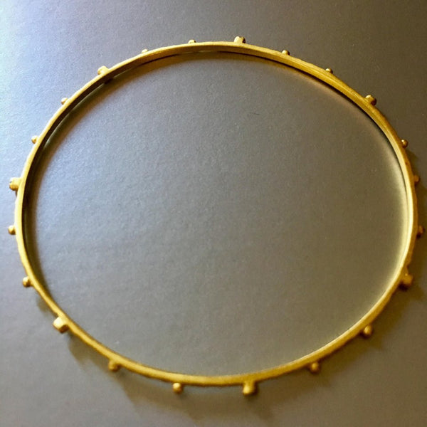 Dainty, petite and beautifully textured bangle bracelet with gold plating is a loveable, adorable, everyday bangle bracelet that you would not want to ever take it off. Stack it up and enjoy the soft jingling or enjoy them with other cuffs from Mia Siya.