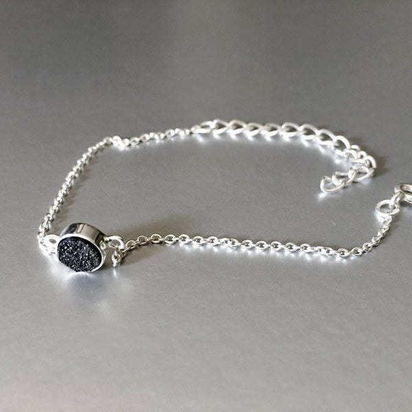 Adjustable, sterling silver, open ring with stunning sparkling black druzy adds an artful addition to your everyday look.