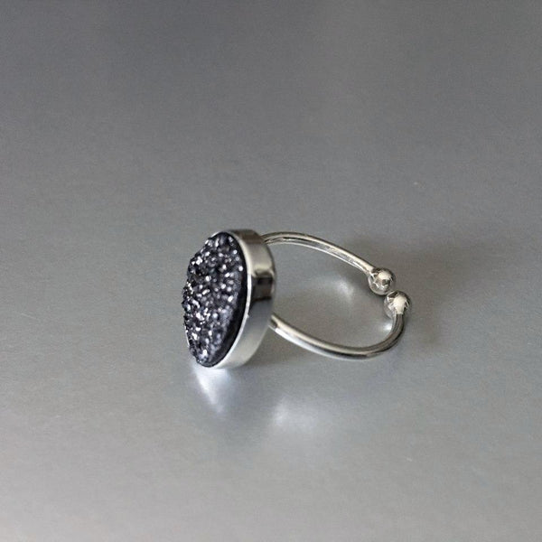 An adjustable, dainty, lightweight, sterling silver bracelet with stunning sparkling black druzy adds an artful addition to your everyday look.