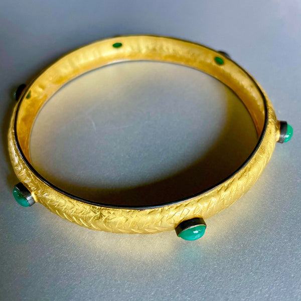 A sophisticated, lightweight, and airy with a clean-cut design, this hand-hammered sterling silver bracelet with gold plating is beyond one's imagination. It literally has 'no weight' hence making it very comfortable on long days when wearing jewelry is a must but with ease!