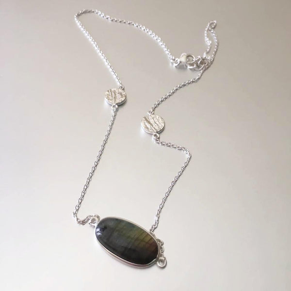 Dainty as can be, this flimsy yet durable sterling silver chain necklace with an adorable designed charm on each side and a glistening, striking labradorite pendant.