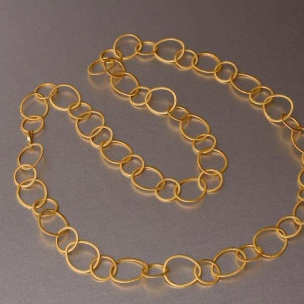 Hand Hammered Lily Earrings In Gold