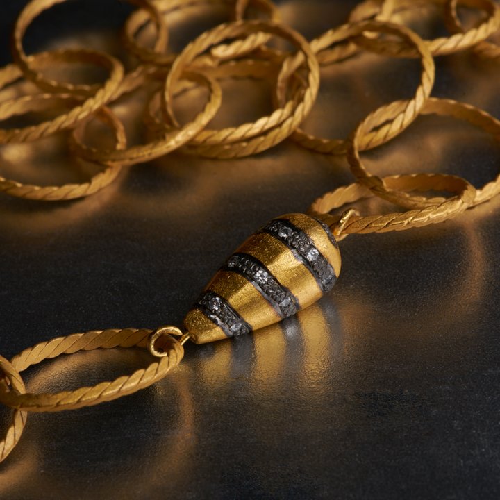 I am biased towards this necklace, since it is my personal favorite. A unique culmination of style and elegance. Cubic zirconia charms enhance this long necklace with minimal effort.