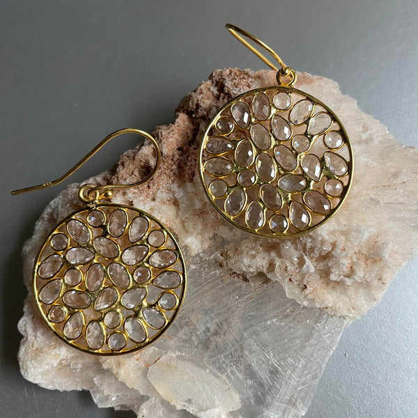 Mesmerizingly elegant and sophisticated pair of dangle earrings which are lightweight and dainty but showcase a bold, statement appeal. Embedded with yellow topaz, which is a stone to manifest your intentions, in alignment with the divine will. 