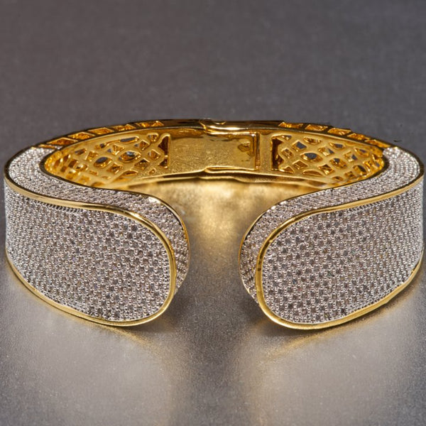 Luana bracelet is beautifully and masterfully embellished with cubic zirconia, which is a fabulous find for anyone who enjoys fine, luxurious taste in jewelry. This gold plated cuff, will go with a multitude of outfits, from casual to dressy and seamlessly transition from day to night. 