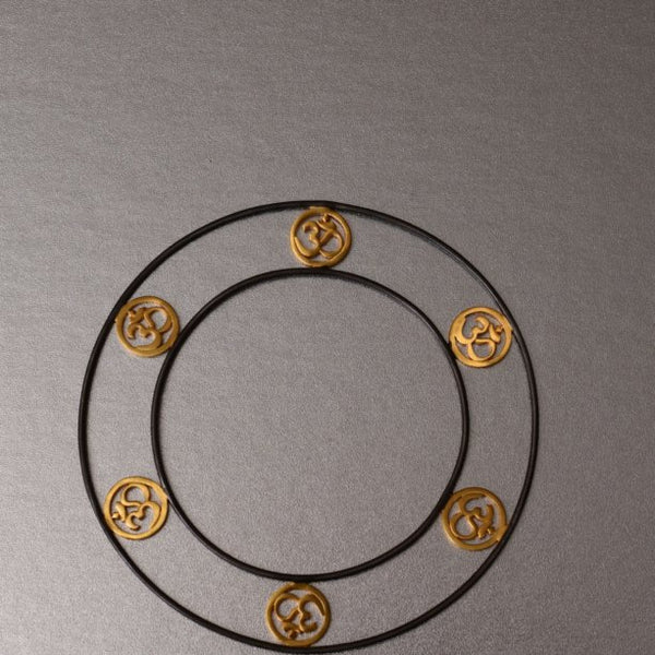 Fit for a ramp walk OR simply be embraced with love by anyone who likes jewelry with an edge. A little bold yet dainty but surely a conversation piece. A spiritually inclined design with OM charms.