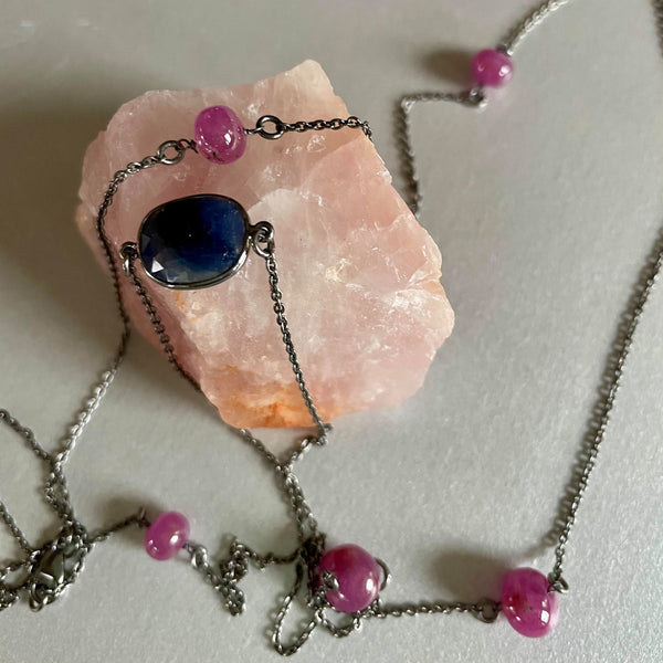Oxidized metal plating over sterling silver always looks rather interesting especially when paired with rubies and blue sapphire gemstones.  Lightweight, airy and free-spirited, this long necklace flaunts freshness for this beaufiul season, after the long winter we all have had. Rubies are round and weigh in total 14.54 gms whereas the blue sapphire gemstones are in irregular shape and weigh 5.5 gms. The necklace is 37 inches in length and can be layered easily.