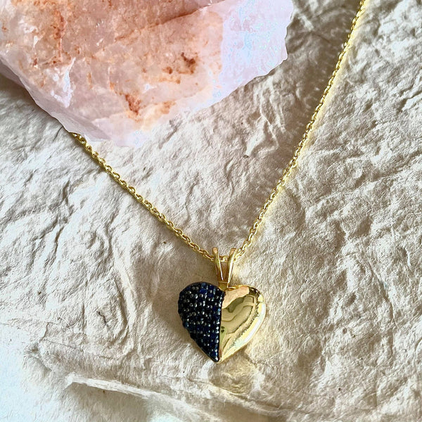 This exquisite blue sapphire necklace is one of a kind.This exquisite necklace is 1.25 inches in size, sapphires are round in shape and weigh 0.47 in carat amount. The chain is 16 1/2 inches in length. When worn it is almost 8 3/4 inches. Sits beautifully on the collar bone.