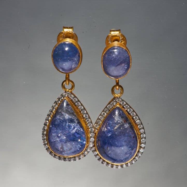 Our most iconic silhouette, the Kani Earrings with Tanzanite. Its deep blue color is one of the most extravagant colours known to Man. It personifies immaculate, yet unconventional elegance. Tanzanite is considered to be a valuable spiritual stone that can be used in order to relate to other realms or for meditation.