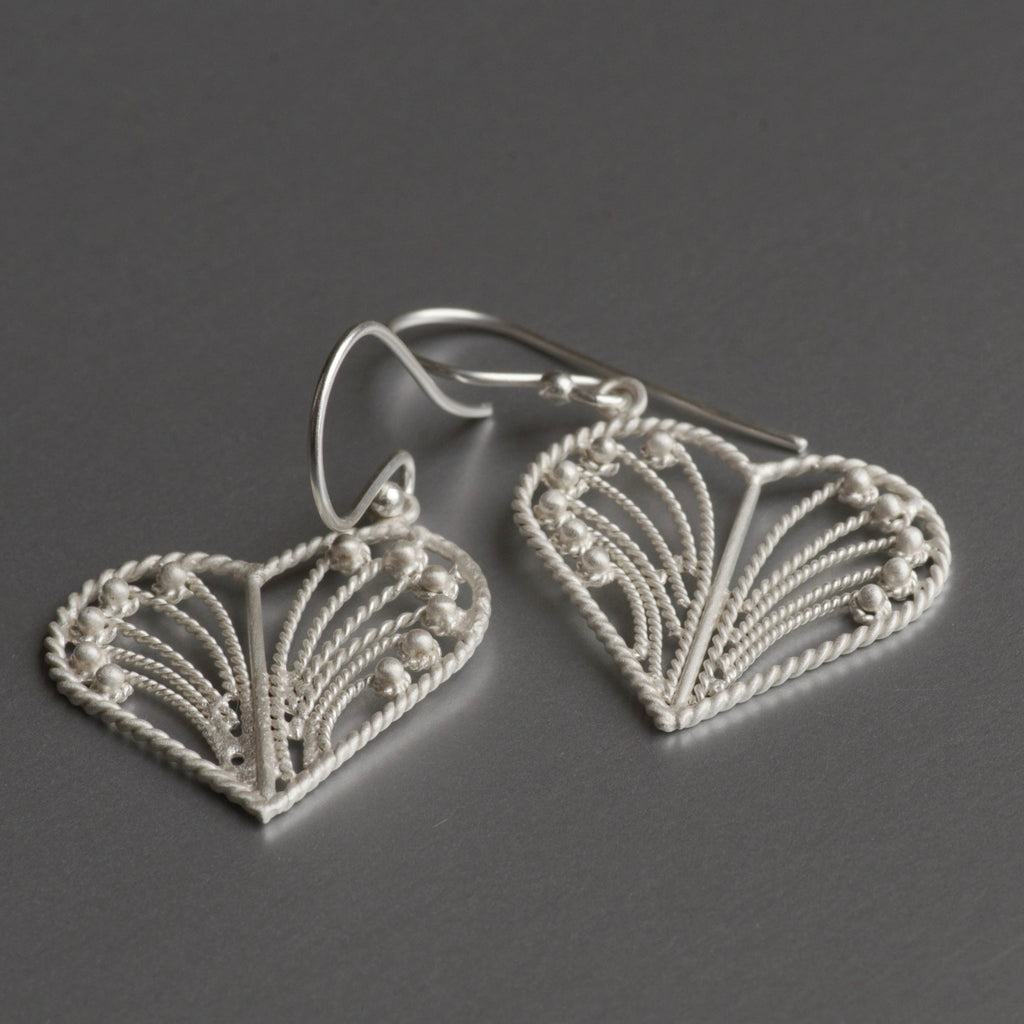 Featherweight, heart-shaped, filigree work, dainty earrings with hand-hammered texture, these cute little delicate yet durable earrings are sure to win your heart and others around you.   Fun and playful, these popular earrings are simple and clean for an effortless style that can go with anything. The most popular pair of earrings sold in 2021 & 2022.
