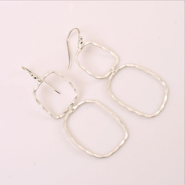 With a petite frame these delicate, hand hammered silver drop earrings are sure to complement your every style. Featherweight, dainty yet bold and beautiful