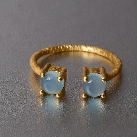 This adjustable, dainty ring with aqua chalcedony gemstones in a hand hammered texture, is simply a pop of fresh colour and style.