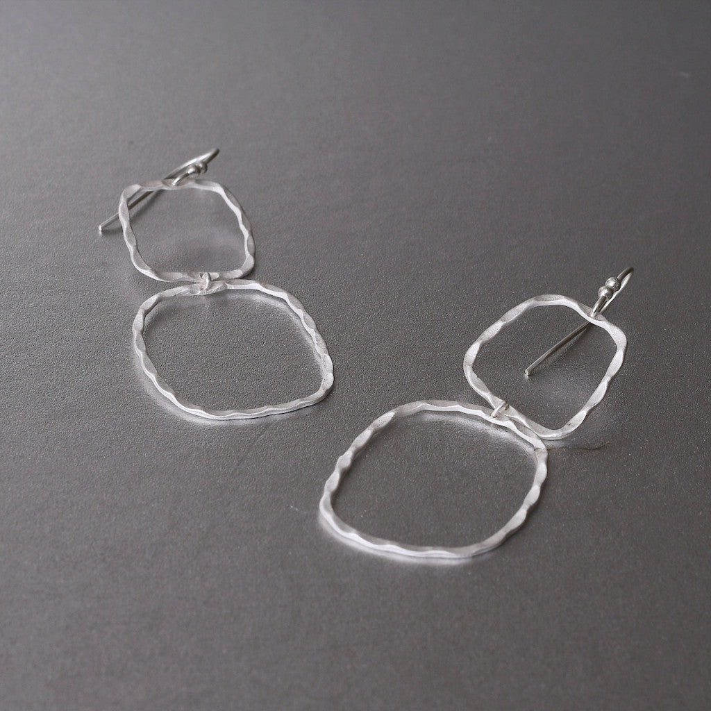 With a petite frame these delicate, hand hammered silver drop earrings are sure to complement your every style. Featherweight, dainty yet bold and beautiful