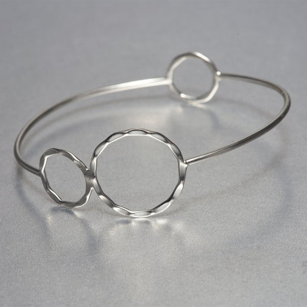 This lightweight, dainty, hand-hammered sterling silver Asa bracelet, depicts the flawless appeal of fine, boutique jewelry. Pair it with other hand hammered textured cuffs and create a unique style of your own. Size 7 only. Also available in Gold.