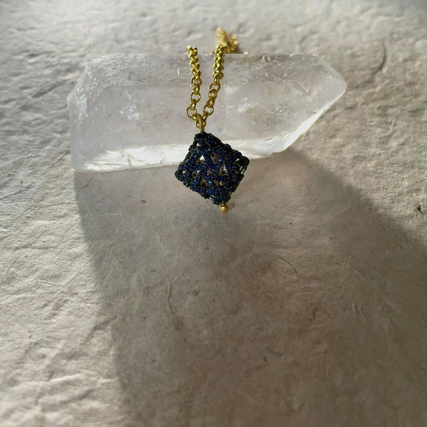 A ravishing, eye-catching, glamorous design that may seem rather simple from a distance yet creates the most dramatic, luxurious appeal, you deserve your jewelry to leave behind.  Round shaped blue sapphires that weigh 1.87 total and are 1.50 mm in size are studded magnificently on this stunning square-shaped pendant, which is 25x18 and the .925 sterling silver necklace with 18 kt gold plating is 16 inches long. 