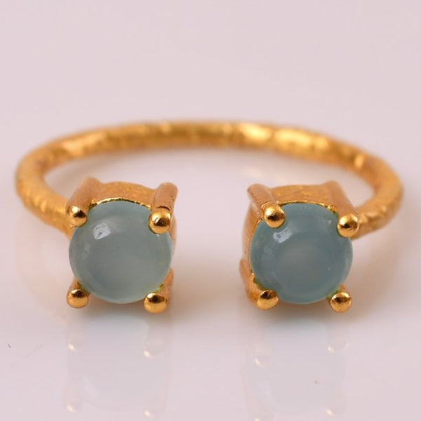 The daintiest piece of jewelry your wardrobe may have ever seen, this aqua chalcedony hand hammered, adjustable ring  brings out that pop of subtle color that makes quite the statement. Wear it as a thumb ring or any which way you desire, the ring can be easily maneuvered around. 