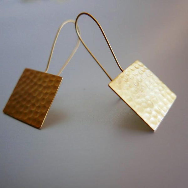 Looks can be deceiving. Lightweight yet bold in appearance, these hand hammered earrings are a beautiful culmination of style, elegance and poise.