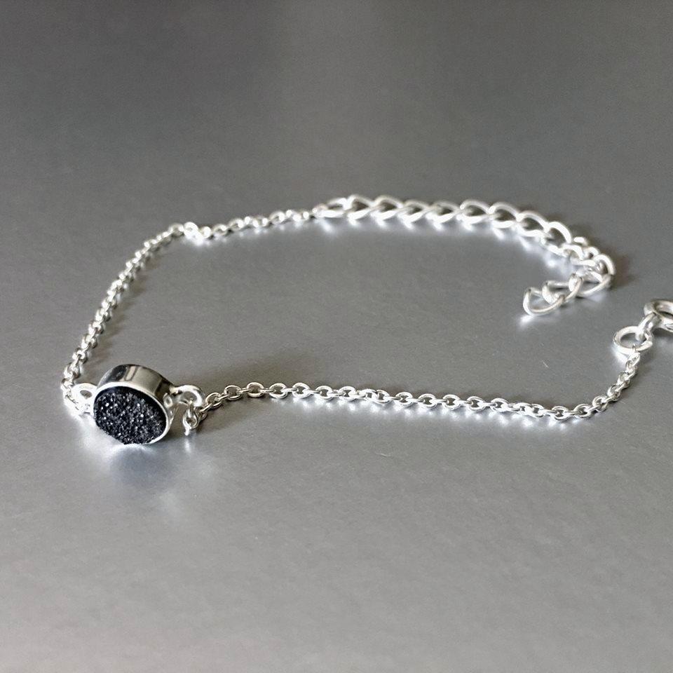 An adjustable, dainty, lightweight, sterling silver bracelet with stunning sparkling black druzy adds an artful addition to your everyday look.