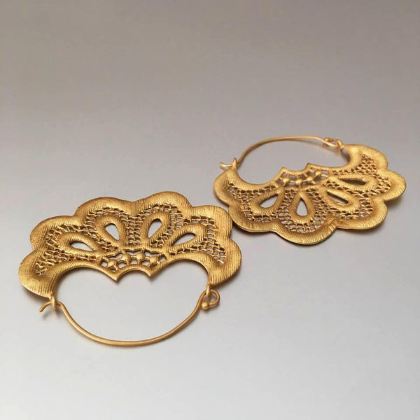 Adorable, flower shaped gold plated earring hoops are a girl's best friend. One pair does it for you: dress it up or wear them casually with tee and jeans. Practically has no weight to them.