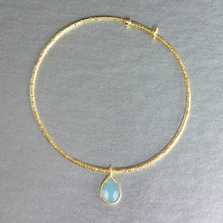 A dainty, lightweight sterling silver, gold plated bracelet showcasing a teardrop aqua chalcedony is an adorable addition to any jewelry collection. Dress down or dress up...stack them or wear them individually. 