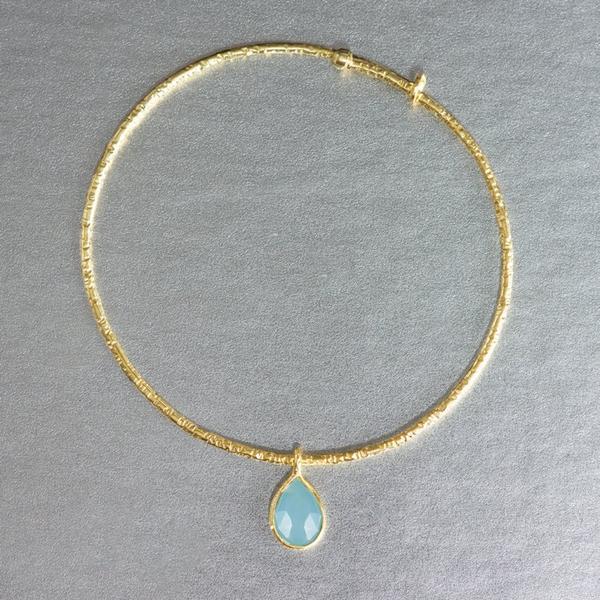 A dainty, lightweight sterling silver, gold plated bracelet showcasing a tear drop aqua chalcedony is an adorable addition to any jewelry collection. Dress down or dress up...stack them of wear them individually.