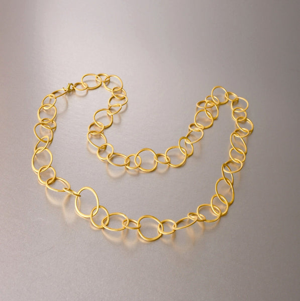 A versatile, evergreen gold plated link necklace, that you may wrap around twice to create a shorter-length necklace and even wear as a choker if wrapped around thrice. The necklace is 30 inches in total. 