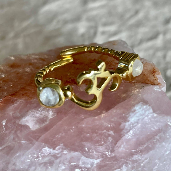 This beautiful adjustable, comfortable ring with moonstone on each side is simply mesmerizing. Hand-carved by jewelry master, in nickel-free brass, and plated with 18k gold, and always finished by hand. Wear it as a thumb ring or on your index, it looks stunning. 