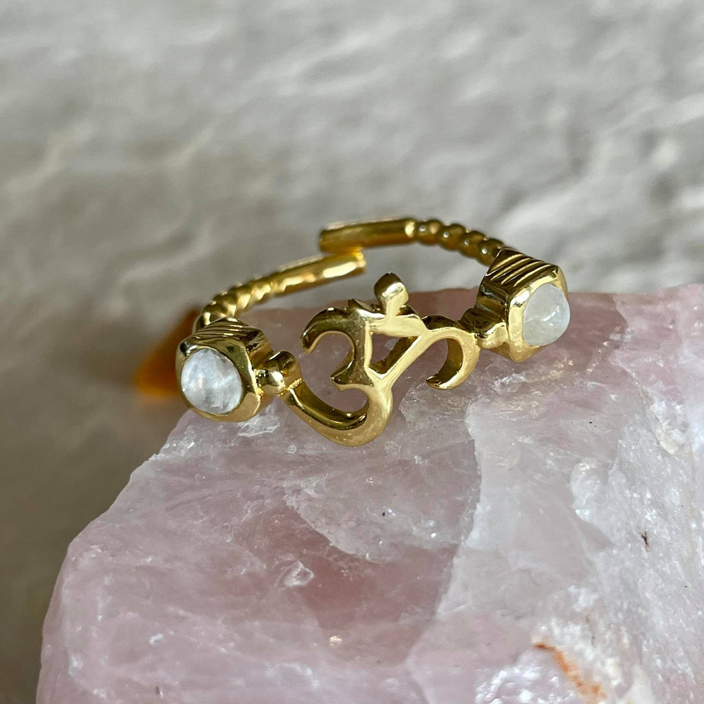  This beautiful adjustable, durable and comfortable ring with moonstone on each side, is simply mesmerizing. Hand-carved by jewelry master, in nickel-free brass, and plated with 18k gold, and always finished by hand. Wear it as a thumb ring or on your index, or any which way you choose the options are endless.