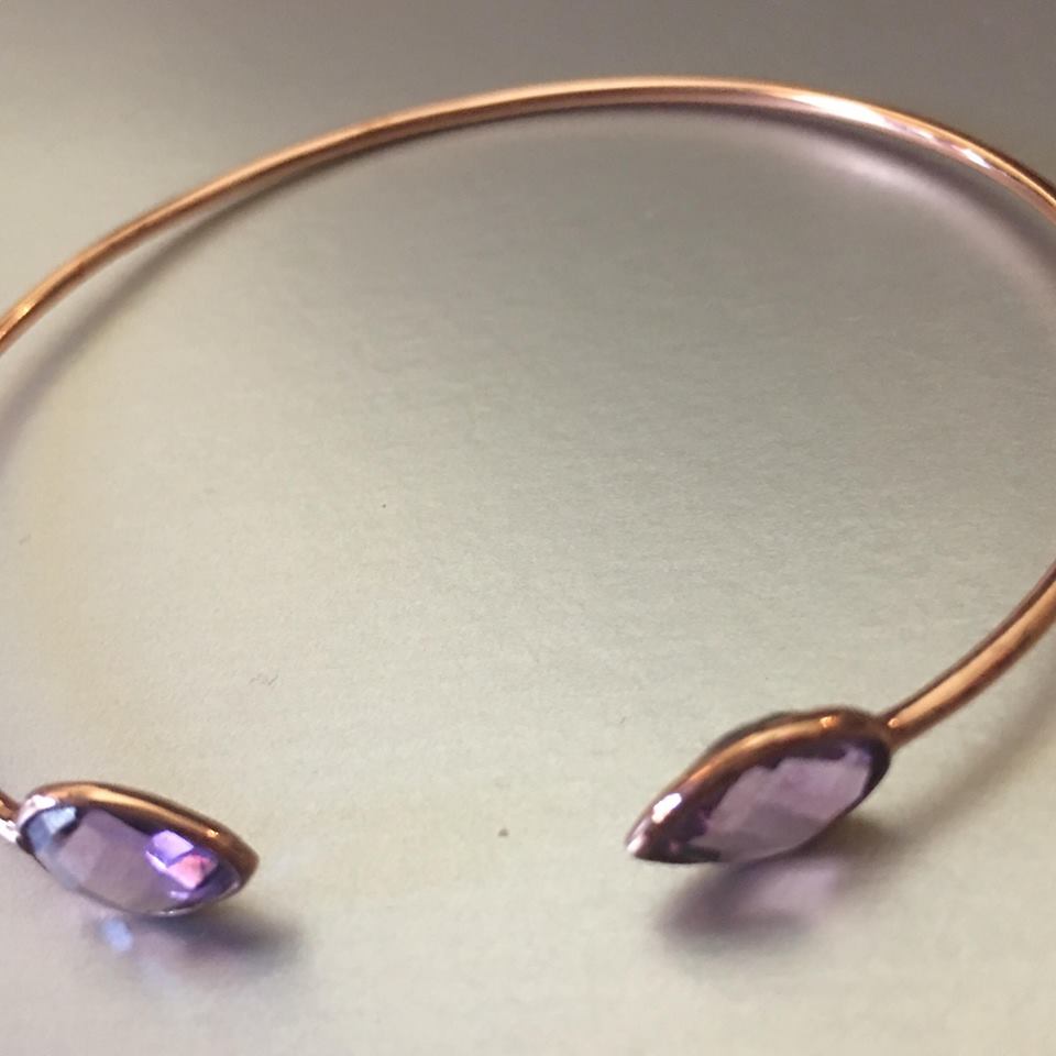 Lightweight, delicate, petite open cuff, enhanced with a gorgeous bright purple amethyst, is mesmerizingly beautiful and eye-catching. 