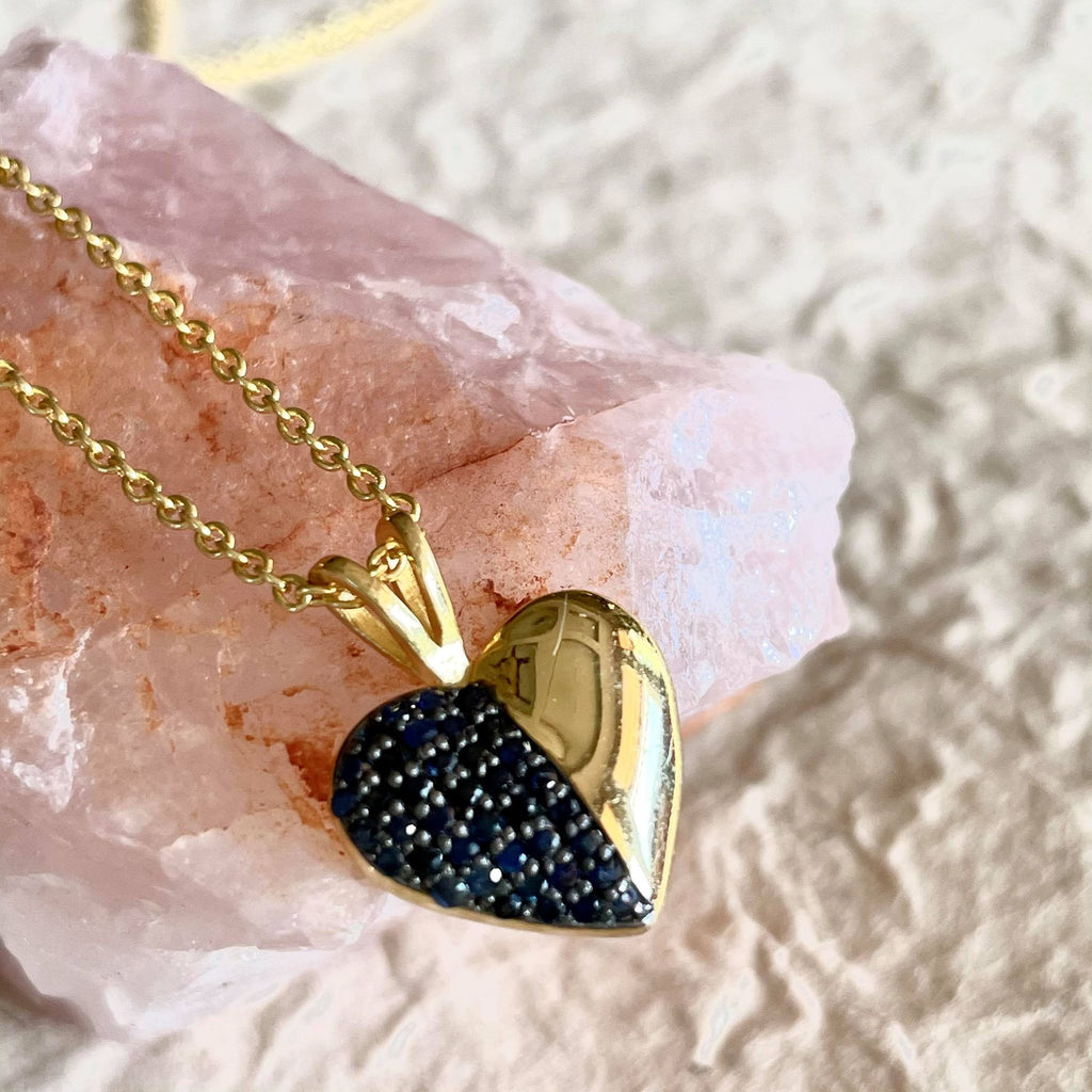 This exquisite blue sapphire necklace is one of a kind.This exquisite necklace is 1.25 inches in size, sapphires are round in shape and weigh 0.47 in carat amount. The chain is 16 1/2 inches in length. When worn it is almost 8 3/4 inches. Sits beautifully on the collar bone. 