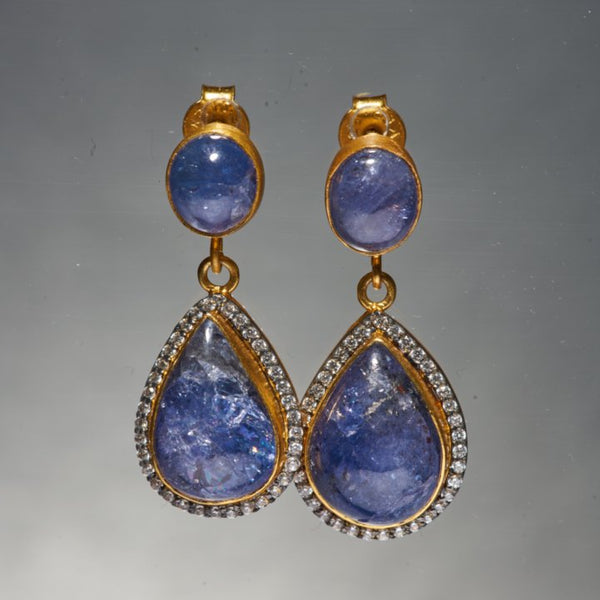 Our most iconic silhouette, the Kani Earrings with Tanzanite.  Its deep blue color is one of the most extravagant colours known to Man. It personifies immaculate, yet unconventional elegance. Tanzanite is considered to be a valuable spiritual stone that can be used in order to relate to other realms or for meditation. 