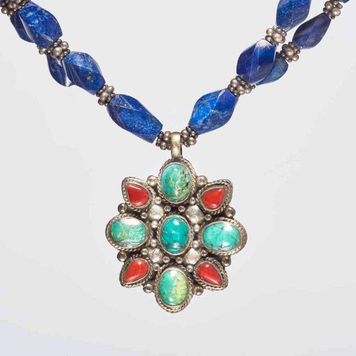 This vibrant and breathtakingly exquisite 18-inch necklace with unstructured 'lapis lazuli' gemstones is one of my personal favorites. A limited-edition necklace that surely can NOT be recreated. The necklace holds graciously a .925 sterling silver pendant which is embedded with beautiful 'turquoise and corals' gemstones. 